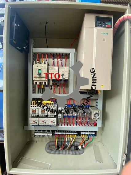 Cashew plant electrical control panel interior, showing breakers, VFD and wiring